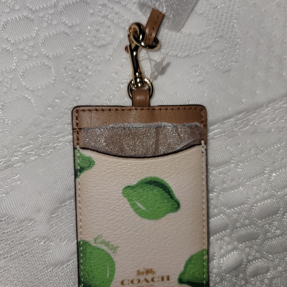 Coach ID with lanyard.